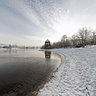 Looking over the frozen Lake Flückiger towards the Black Forest