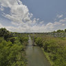 Railroad bridge through a Cuban jungle town - half Gigapixel