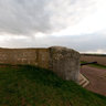 By a concrete casemate