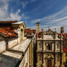 Roofs of the old town seen from an attic window, HDR panorama