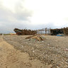 Fishing shacks with ships near Al-Khawhkah - Yemen
