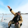 Ice fishing at Lielupe River, Latvia